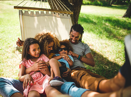 Image of family on hammock